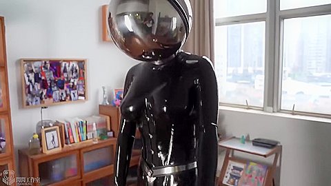 Girl In Latex And Metal And Chastity Belt With Vibrator